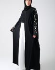 front view of black batwing abaya with embroidery on sleeve