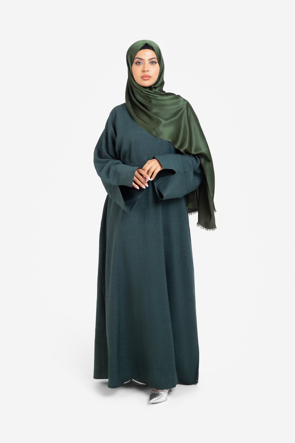 Plain linen dark green closed abaya with split cuffs front view