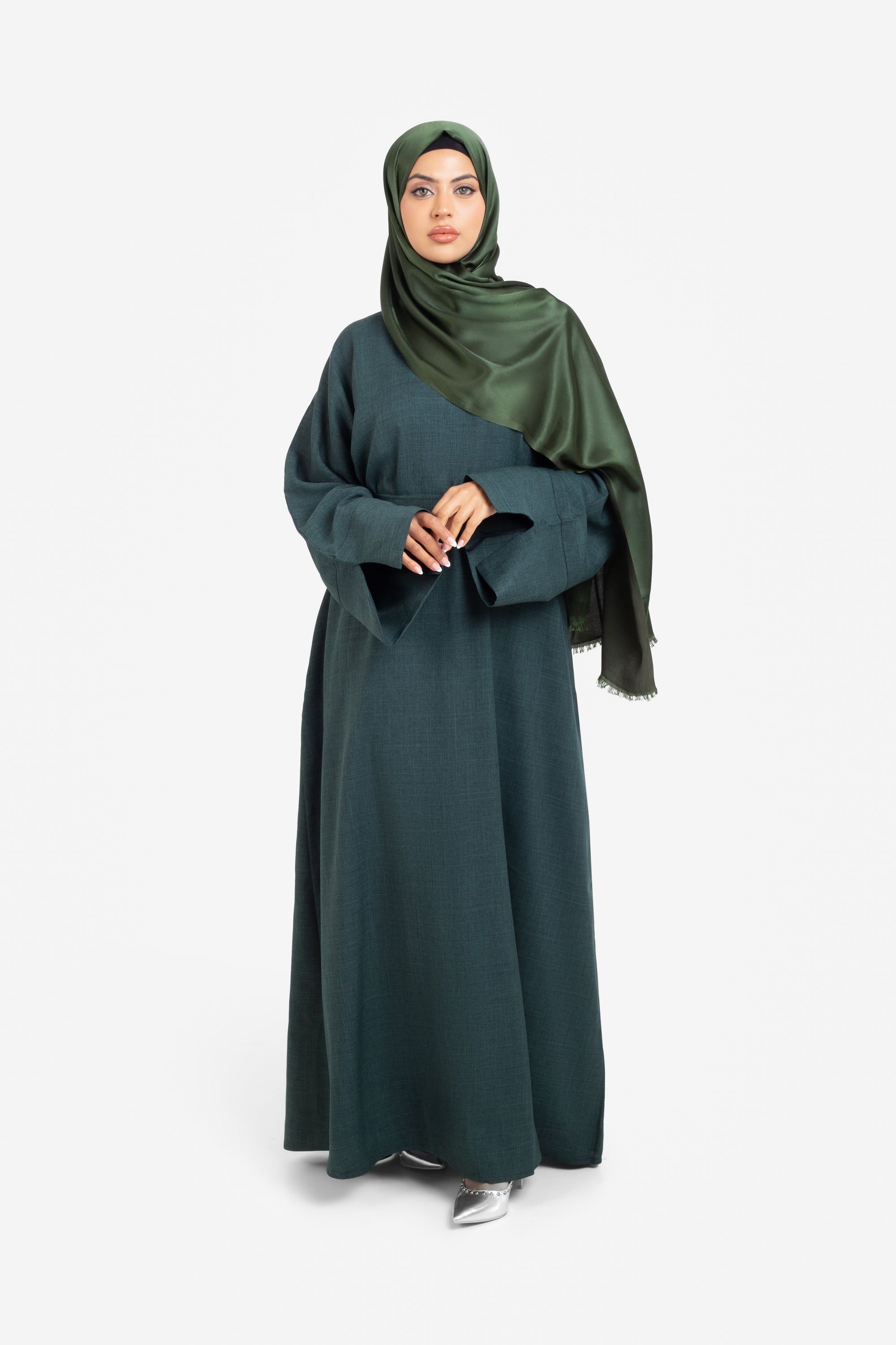 Plain linen dark green closed abaya with split cuffs front view